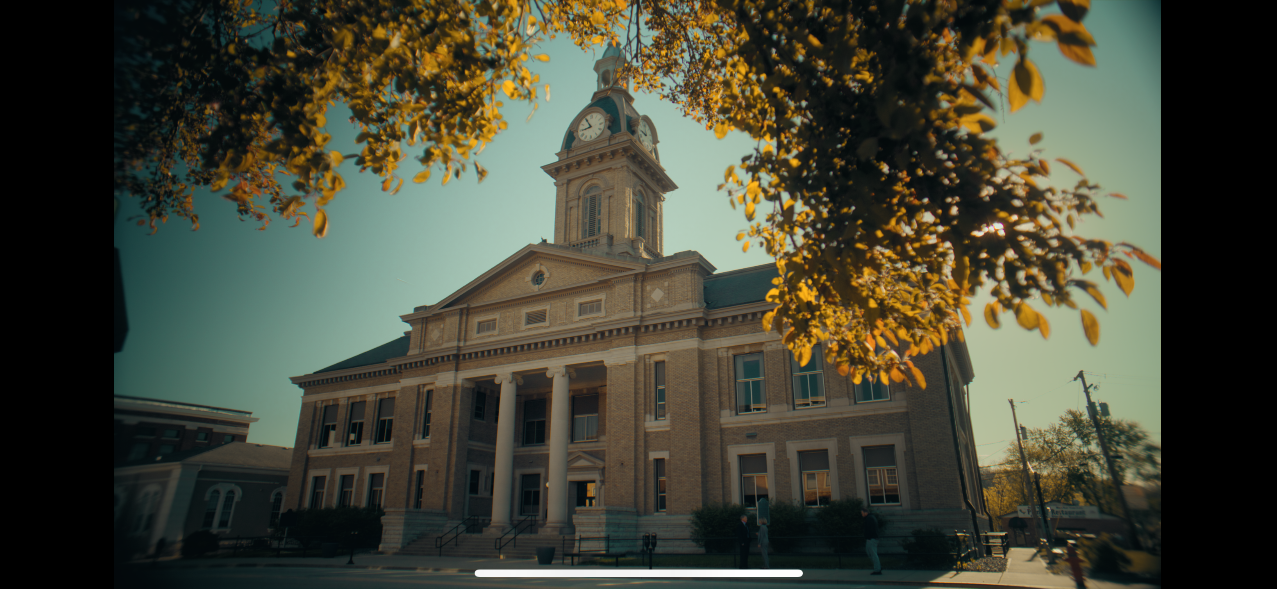 Courthouse framed by autumn leaves