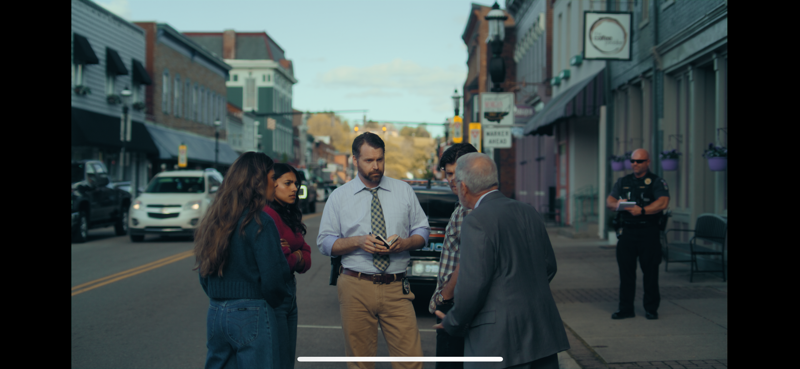 Downtown street scene with cast