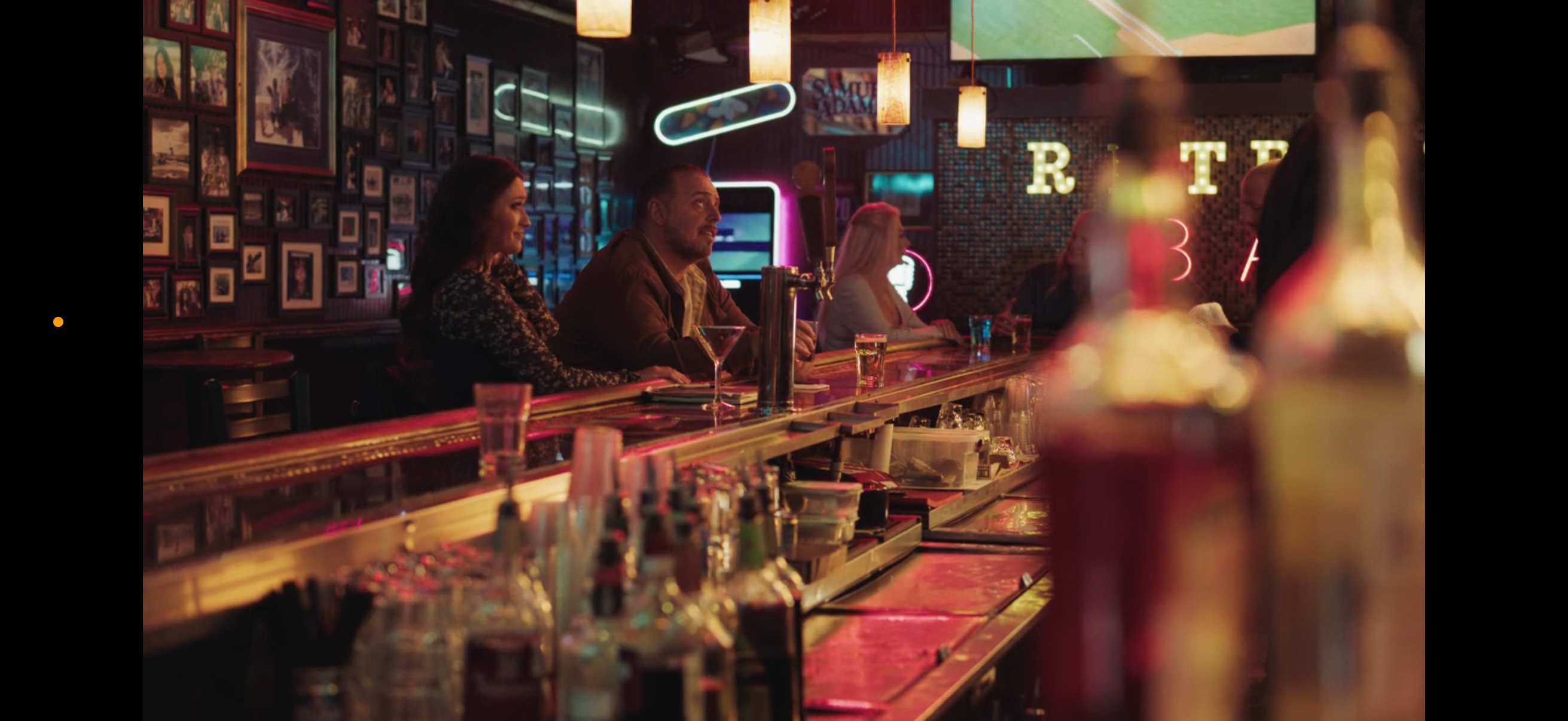 Neon-lit bar interior scene